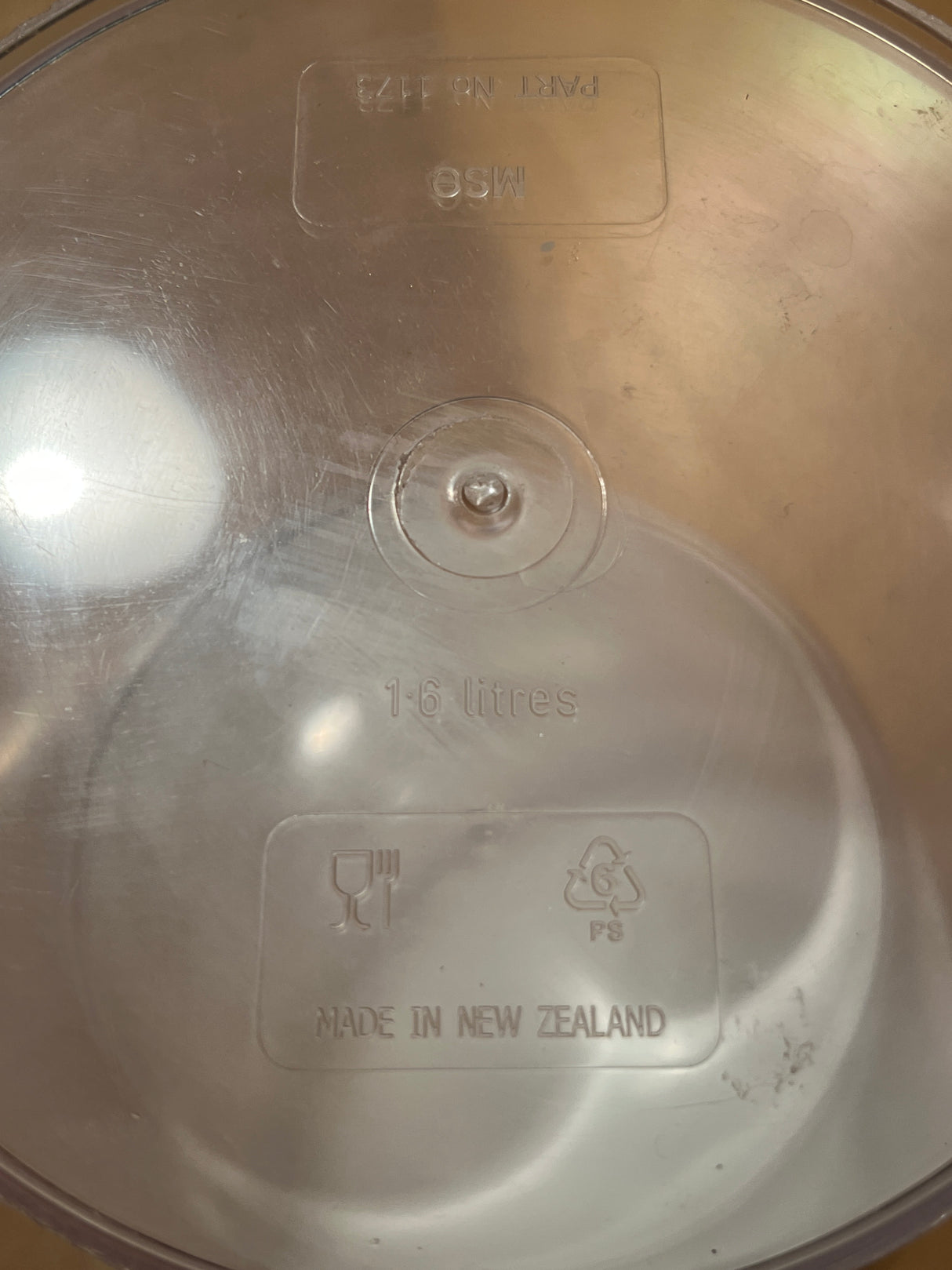 Clear 1.6L Click Clack food storage container lid, showing Made in New Zealand, food-safe symbol, and polystyrene recycling mark for durable, airtight pantry organization.
