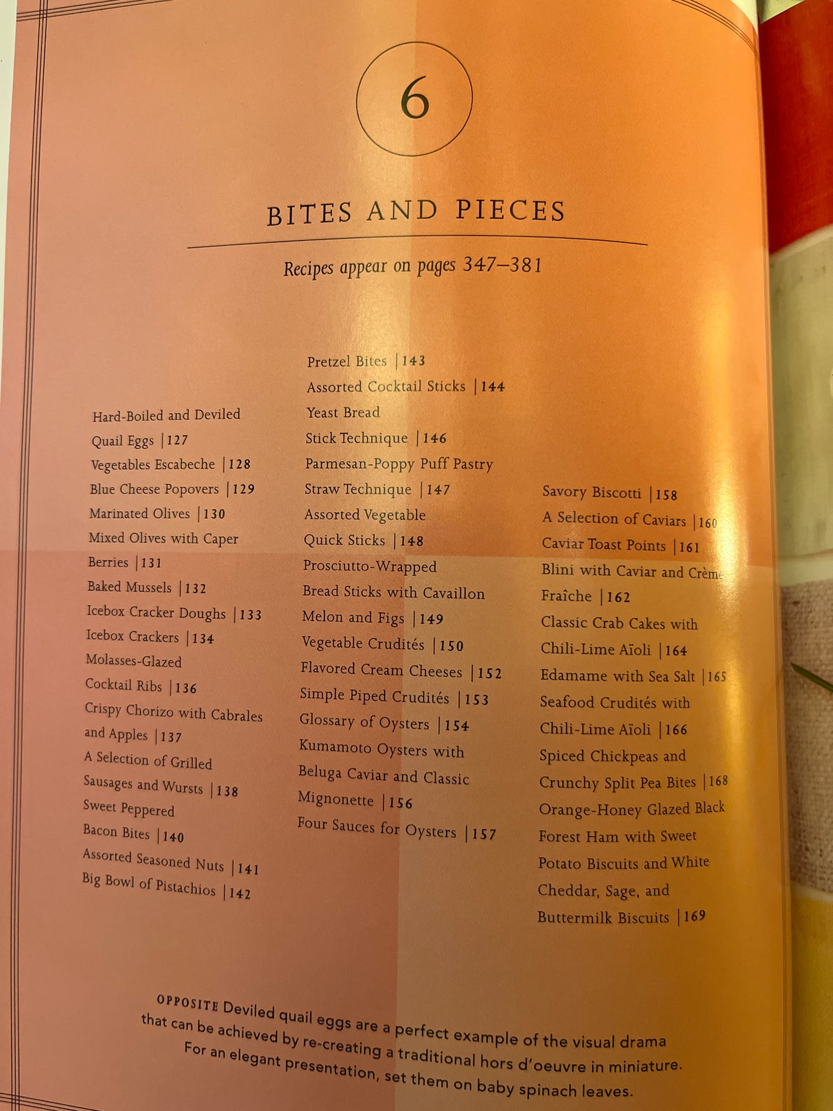 Martha Stewart’s agora D’oeuvres cookbook page listing small-plate recipes like deviled quail eggs, blue cheese popovers, and savory biscotti, emphasizing elegant presentation.
