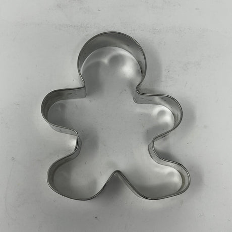 Mid century metal cookie cutter shaped like a man, designed for easy grip with a large handle, ideal for creating unique, rare cookie shapes.