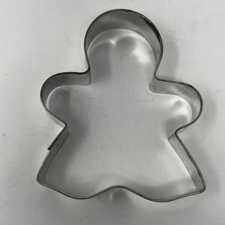 Mid-century metal cookie cutters with adaptive handles, including Christmas and celestial shapes, featuring rare designs like the 1930s Pillsbury's Comicooky Cutter.