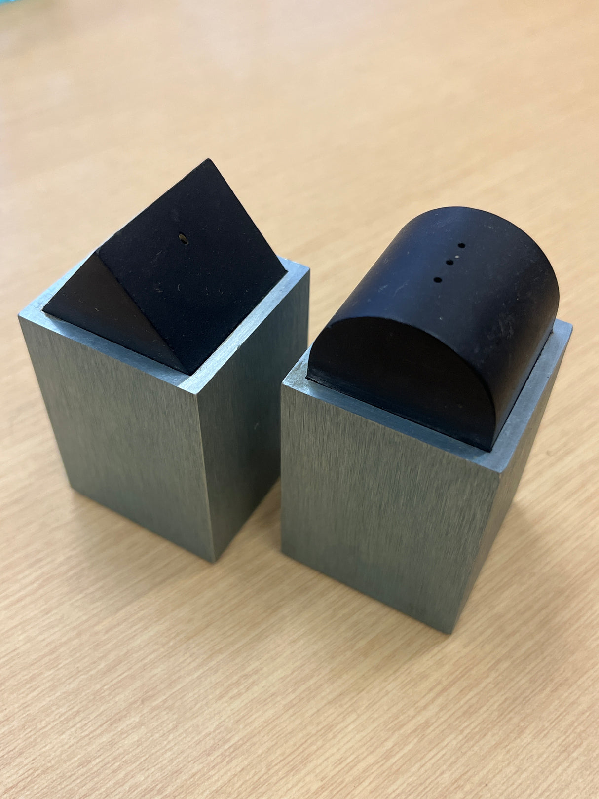 Elika anodized aluminum salt and pepper shakers by David Tisdale, featuring a geometric design with a distinct 1980s Memphis-style aesthetic.