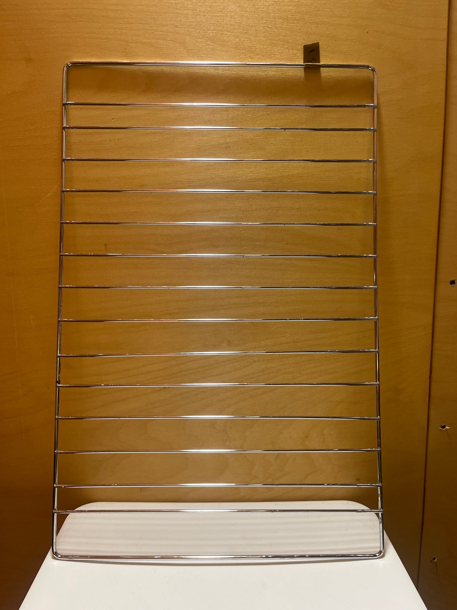 Stainless steel wire oven rack insert showcasing a durable, grid-like structure designed for optimal heat distribution and support during cooking.