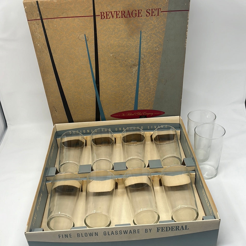 A starter set of Ten-piece Beverage Set of tumblers from Federal Glass Co. displayed in a box with clear glass containers and glasses.