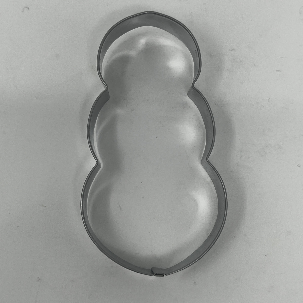 Mid century metal cookie cutters featuring adaptive designs with large handles, including Christmas and celestial shapes, some dating back to the 1930s.