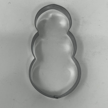 Mid century metal cookie cutters featuring adaptive designs with large handles, including Christmas and celestial shapes, some dating back to the 1930s.