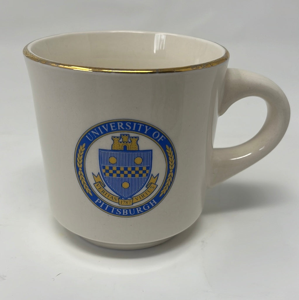 University of Pittsburgh School of Pharmacy mug with gold rim, featuring blue School of Pharmacy lettering and University crest.