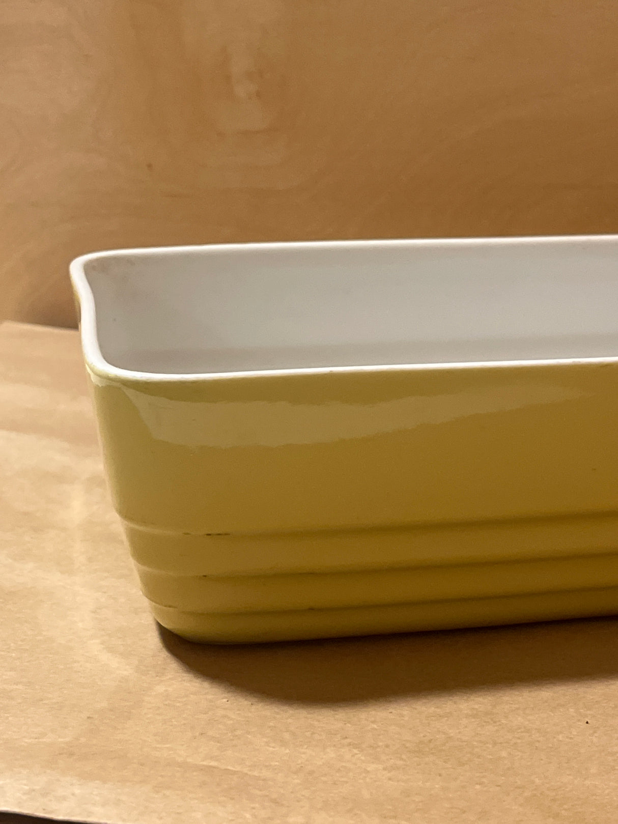 Westinghouse 1940s refrigerator dish, a rectangular enameled ceramic, features a textured exterior and smooth interior, perfect for baking or serving.