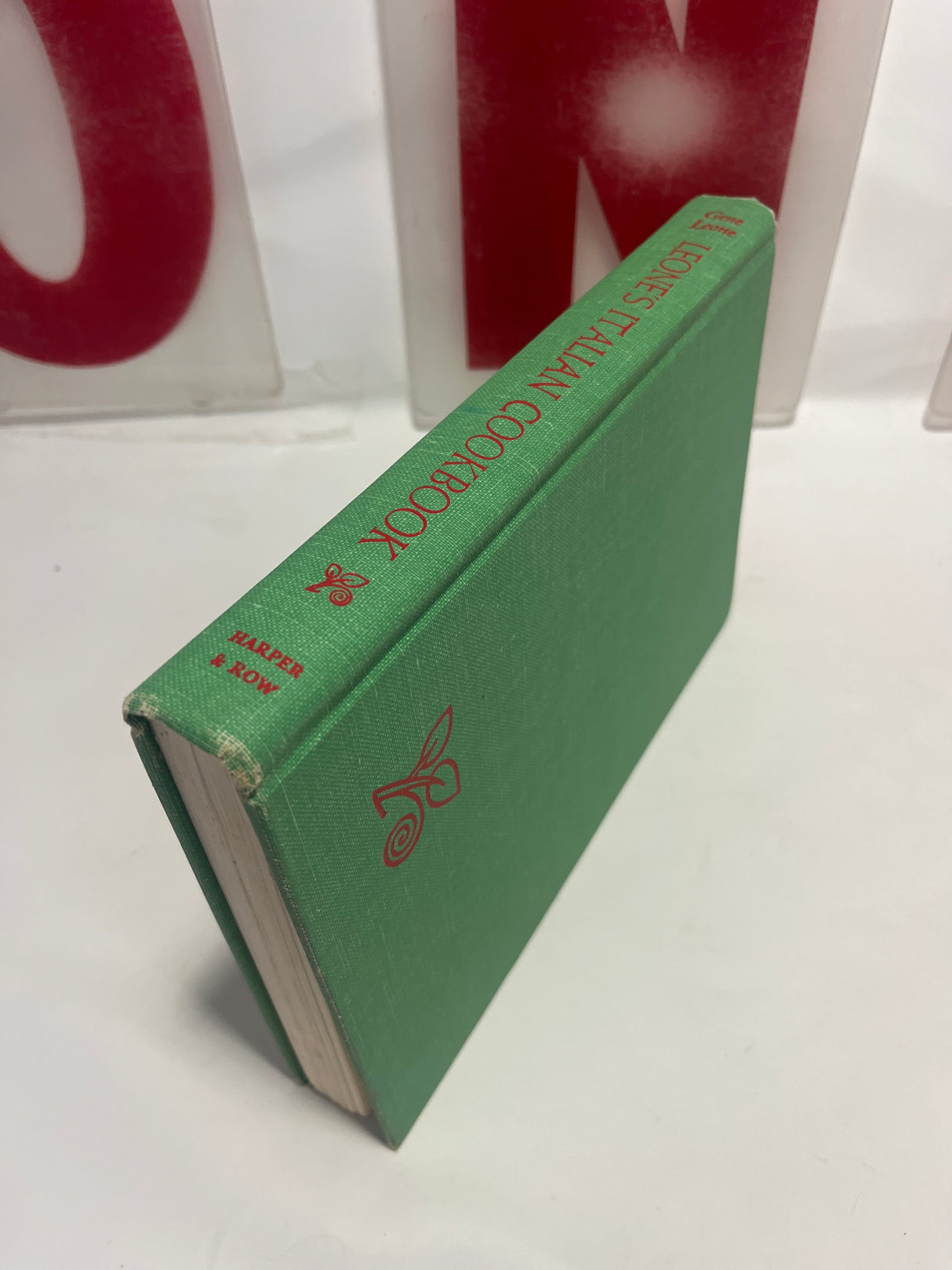 Leone’s Italian Cookbook (1967 First Edition), green cloth-bound hardcover by Gene Levine, featuring recipes from a renowned New York restaurant, published by Harper & Row.