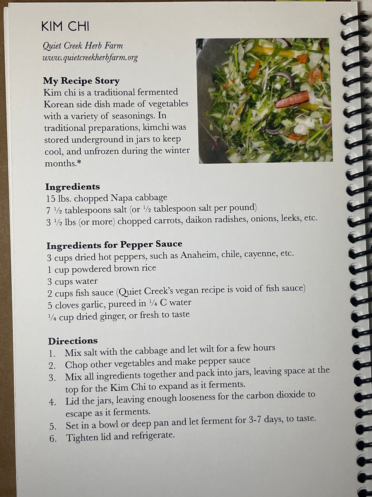 Recipe page from the Book at Quiet Creek Herb Farm, featuring kimchi ingredients and instructions, with a photo of chopped seasoned vegetables.