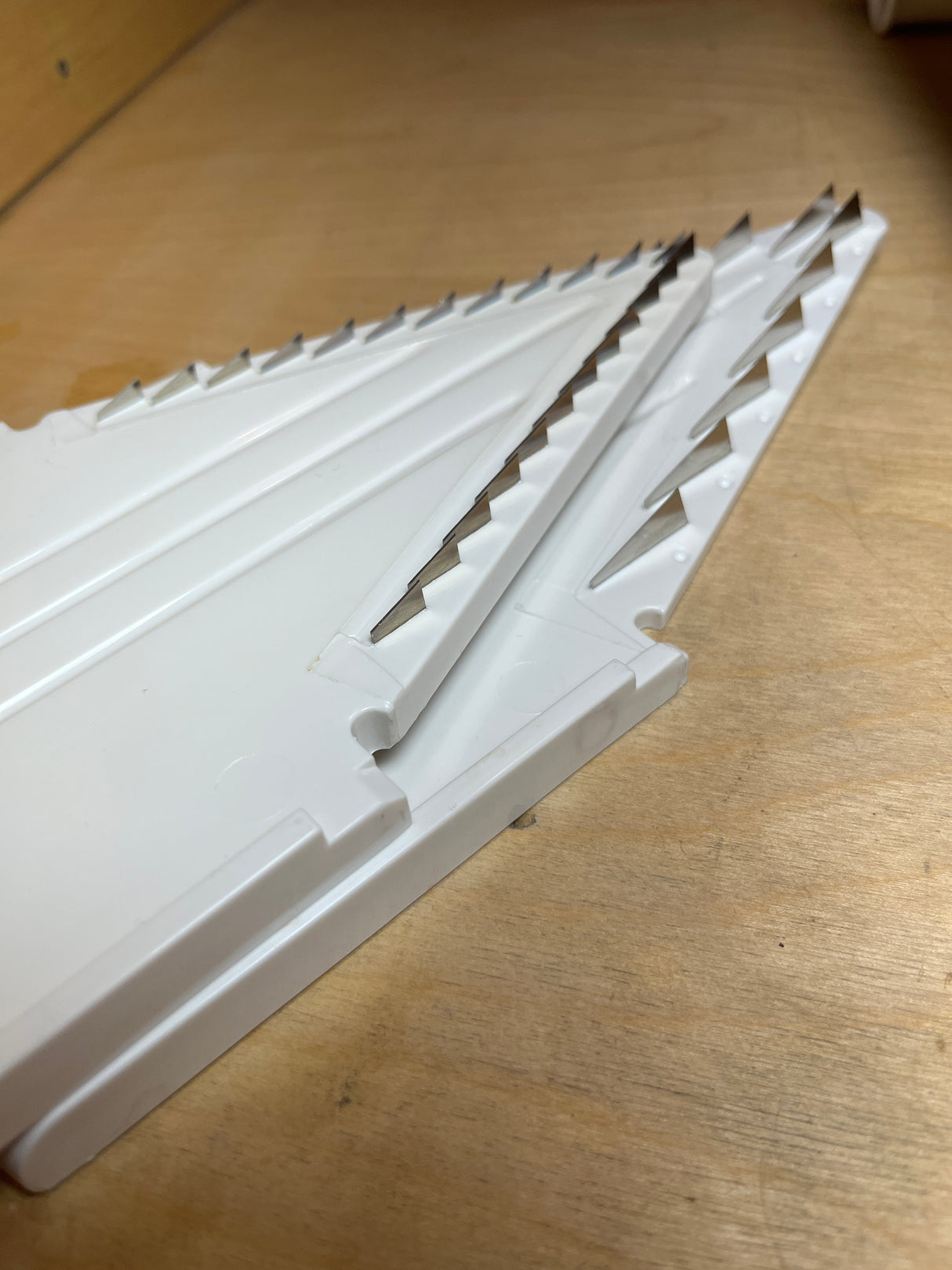 Zyliss Easy Slice mandolin blade insert with angled stainless-steel blades for slicing vegetables into thin slices or julienne strips.