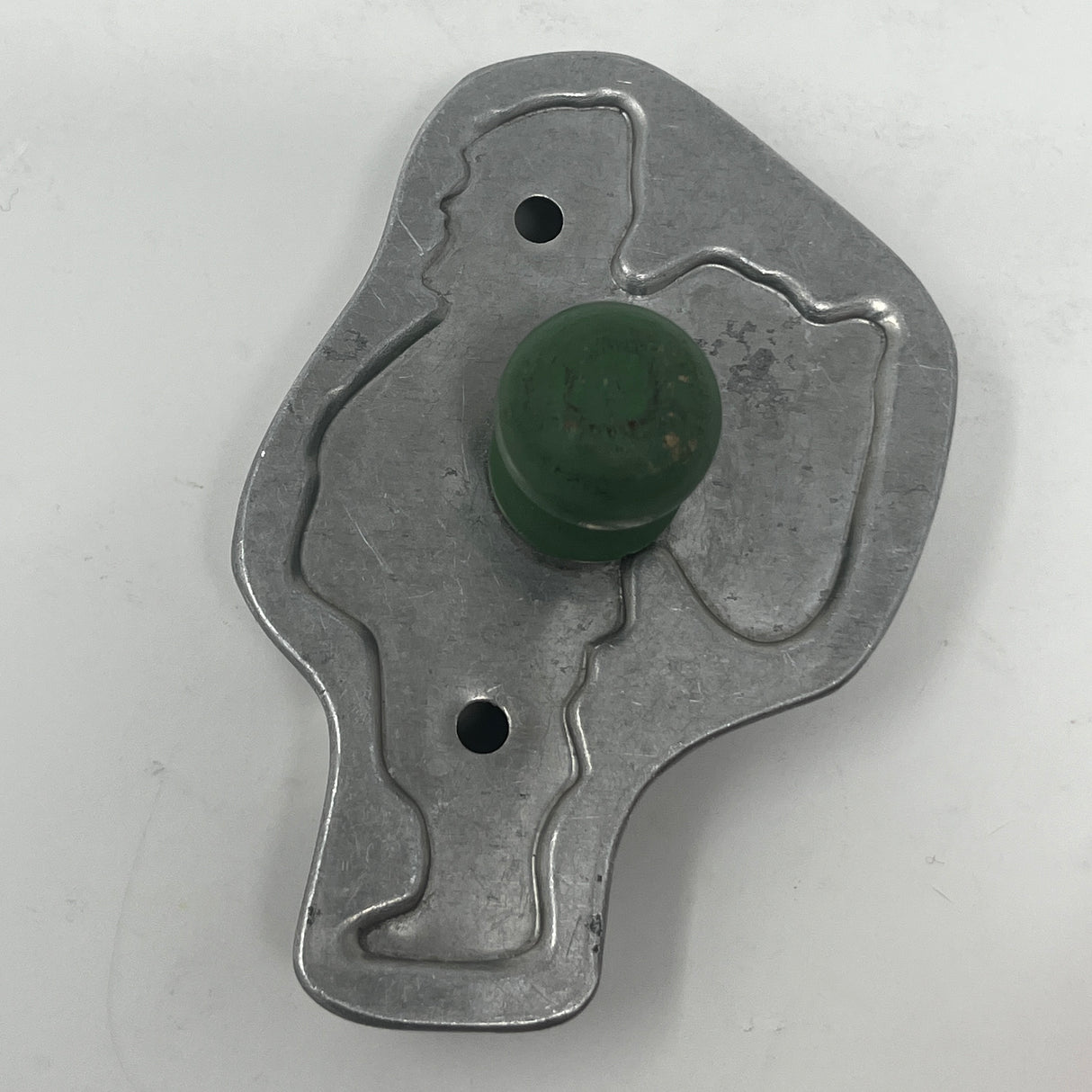 Mid-century metal cookie cutter with green knob, part of an adaptive collection featuring easy-to-grip handles and rare shapes from the 1930s.