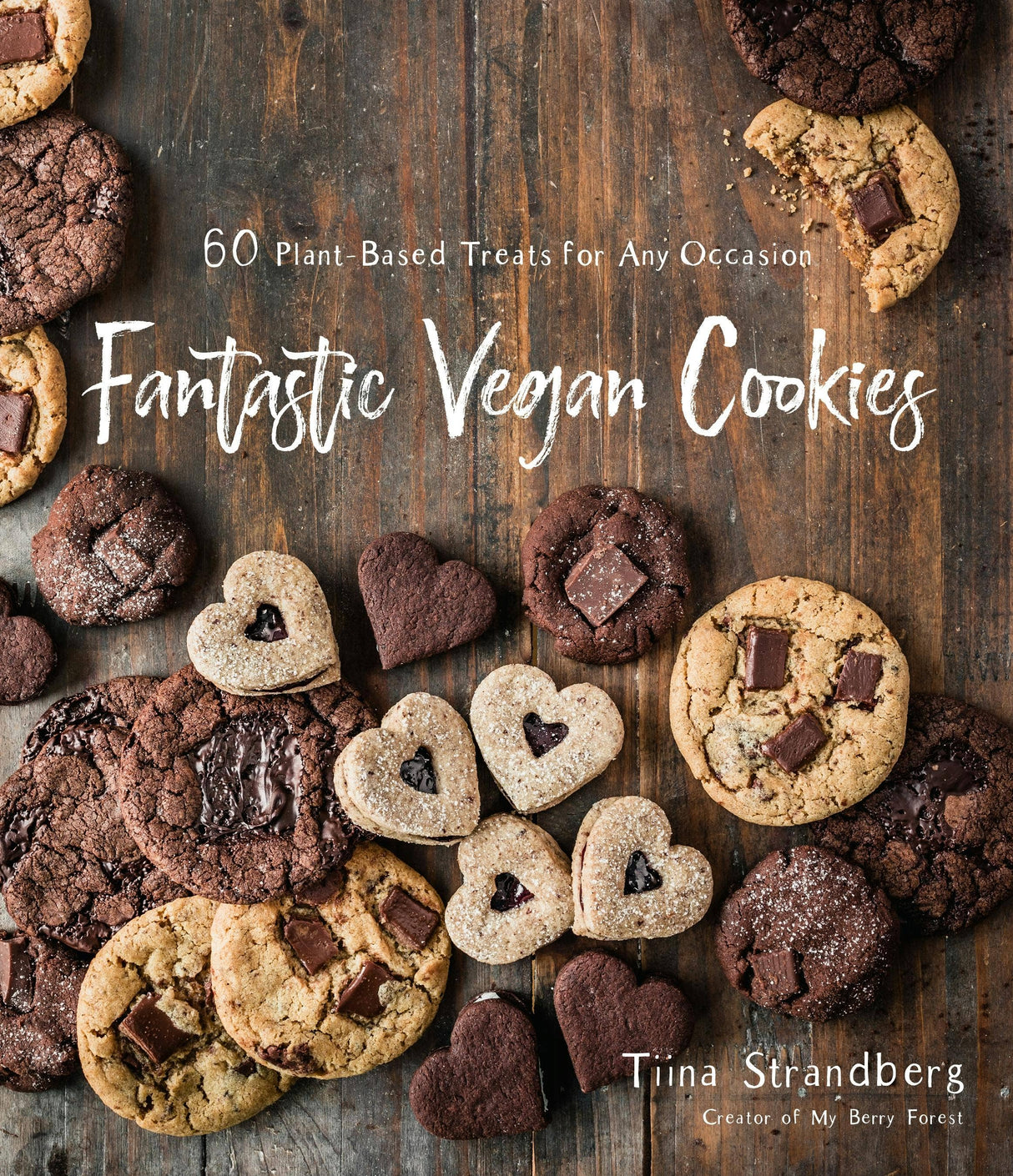 Cover of Fantastic Vegan Cookies: 60 Plant-Based Treats showing assorted cookies on a rustic table, emphasizing vegan recipes by Tiina Strandberg from My Berry Forest.