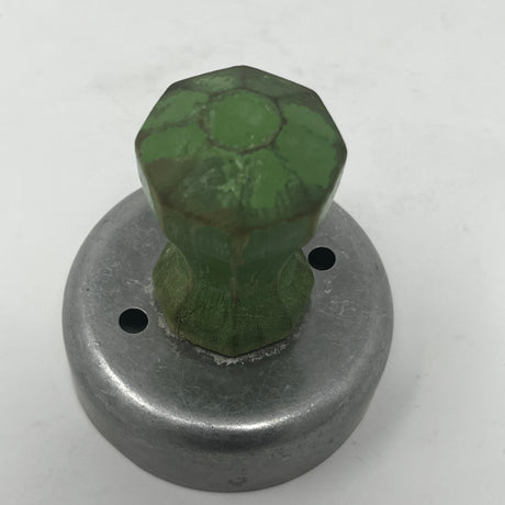 Mid century metal cookie cutters, including celestial and holiday shapes like moons and stars, feature large handles for easy gripping, some dating back to the 1930s.