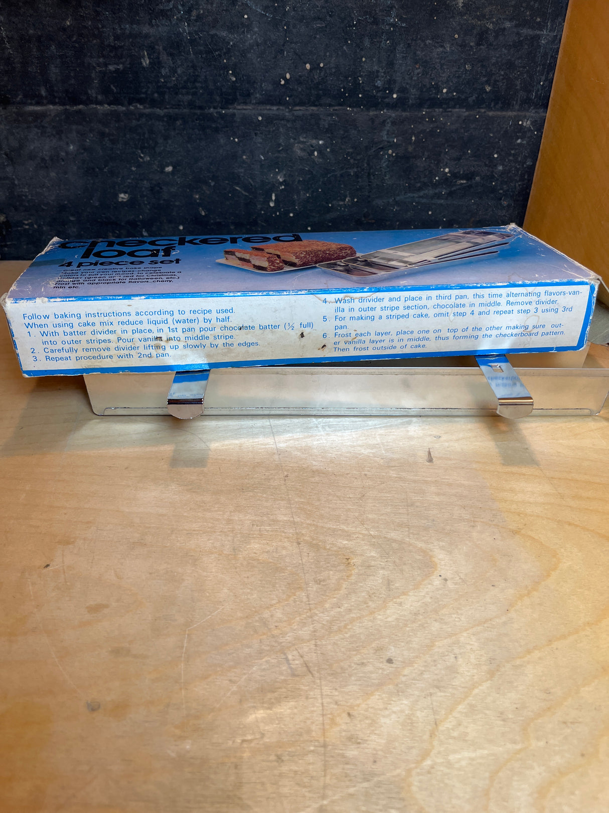 Battenburg cake divider checkered loaf 4-piece set includes a loaf pan and metal dividers, ideal for baking striped cakes or breads with checkerboard patterns.