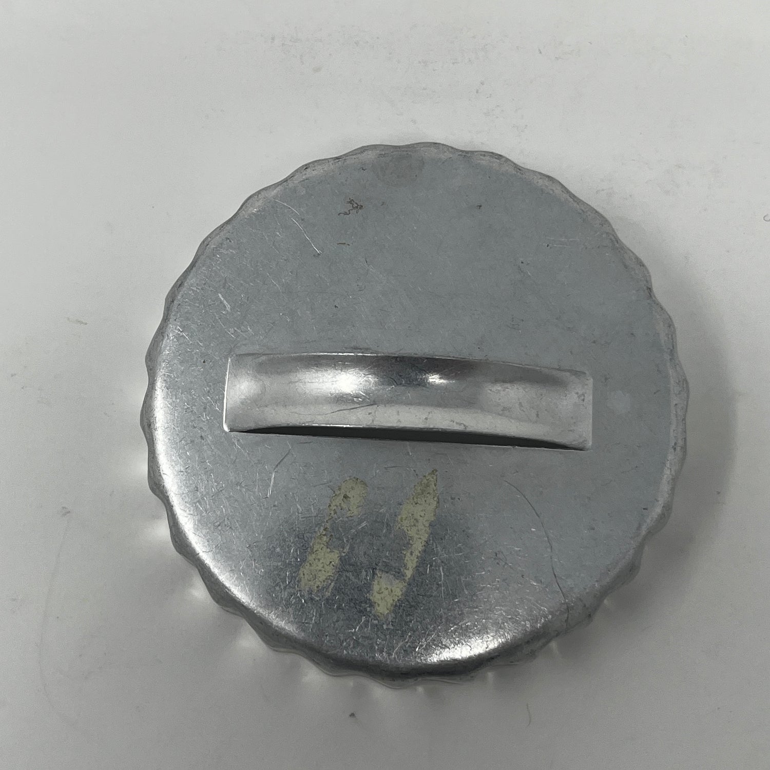 Mid-century metal cookie cutter with a round metal cap and handle, designed for easy grip, ideal for creating various shapes, including holiday and celestial themes.