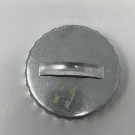 Mid-century metal cookie cutter with a round metal cap and handle, designed for easy grip, ideal for creating various shapes, including holiday and celestial themes.