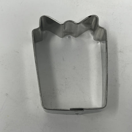 Mid century metal cookie cutters featuring adaptive large handles, showcasing a collection of holiday and celestial shapes, including rare 1930s designs like the Pillsbury Comicooky Cutter.