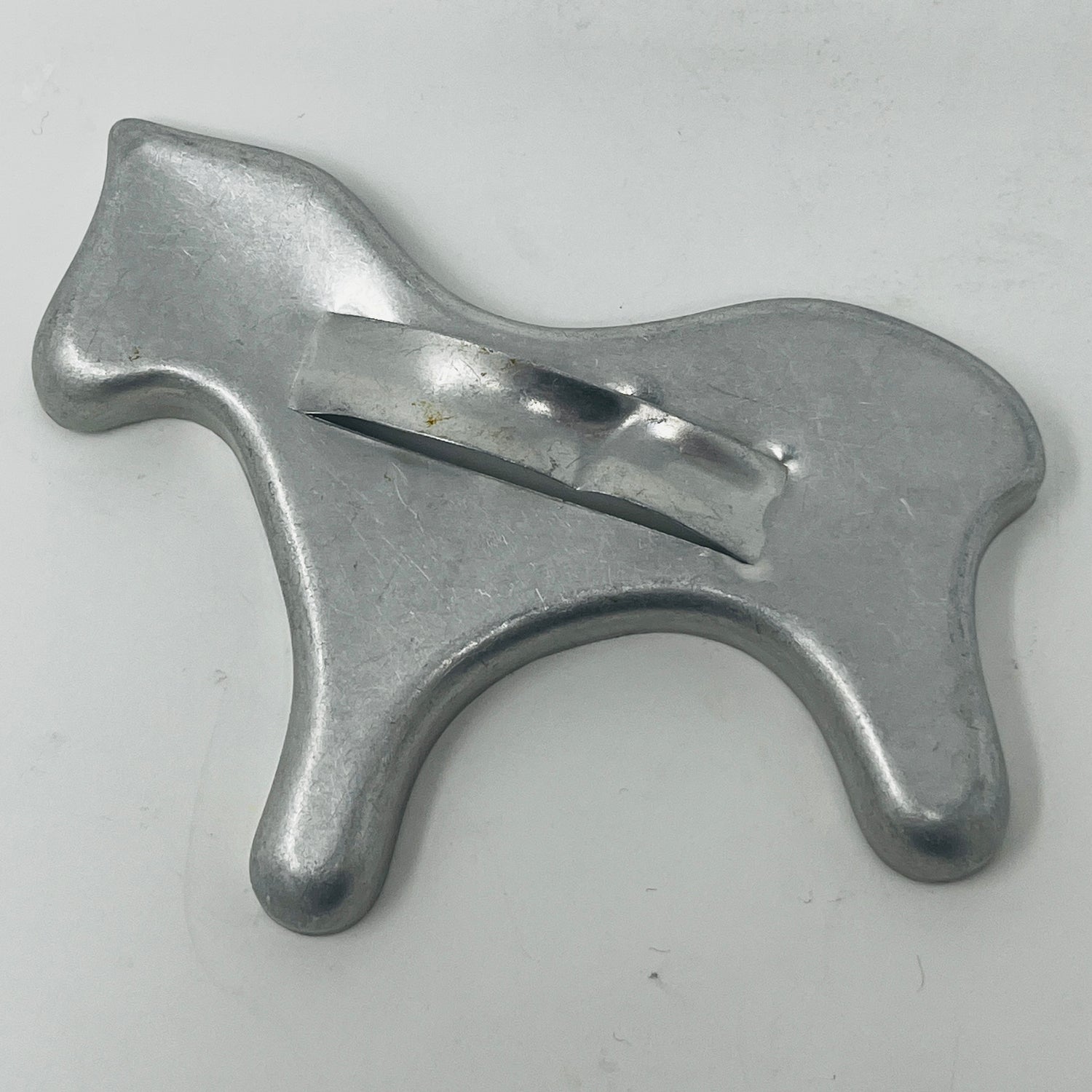 Mid century metal cookie cutter with a large handle, ideal for easy gripping, part of a collection featuring diverse shapes, including vintage Pillsbury's Comicooky Cutter.