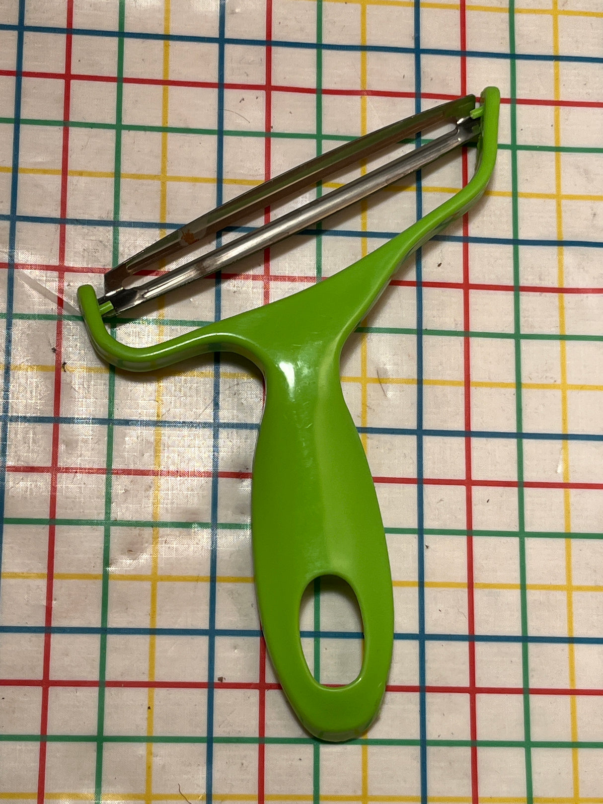 Food Y-Peeler for shredding cabbage - stainless steel blade and green plastic handle