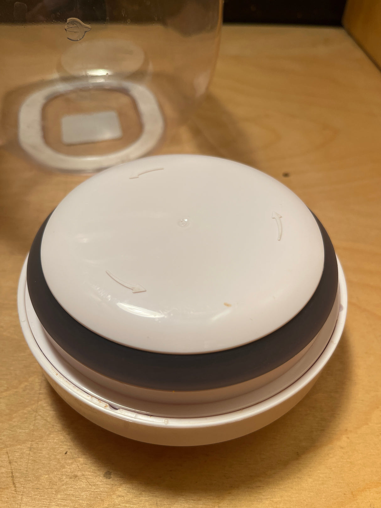 OXO POP medium food storage jar 3 qt. twist-on lid with gray silicone seal, displayed on a shelf, highlighting its airtight, easy-to-use design.