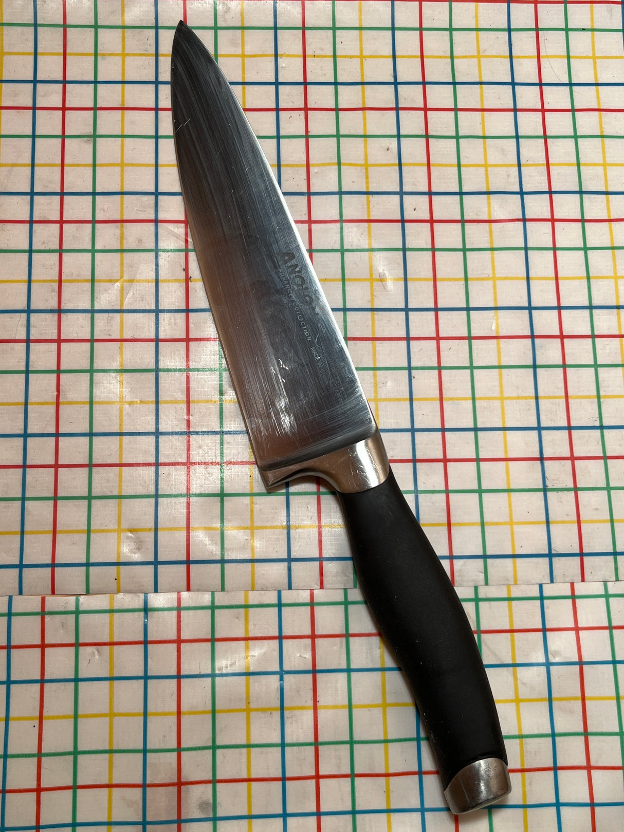 8" Chef knife - carbon steel blade ice hardened and glass finished with Santoprene grip handle - Anolon
