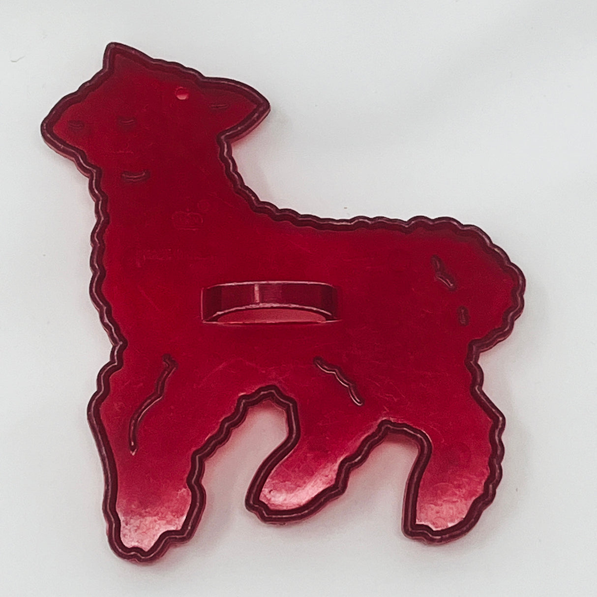 Vintage red plastic animal-shaped cookie cutters, some with Crown logo, made in USA.