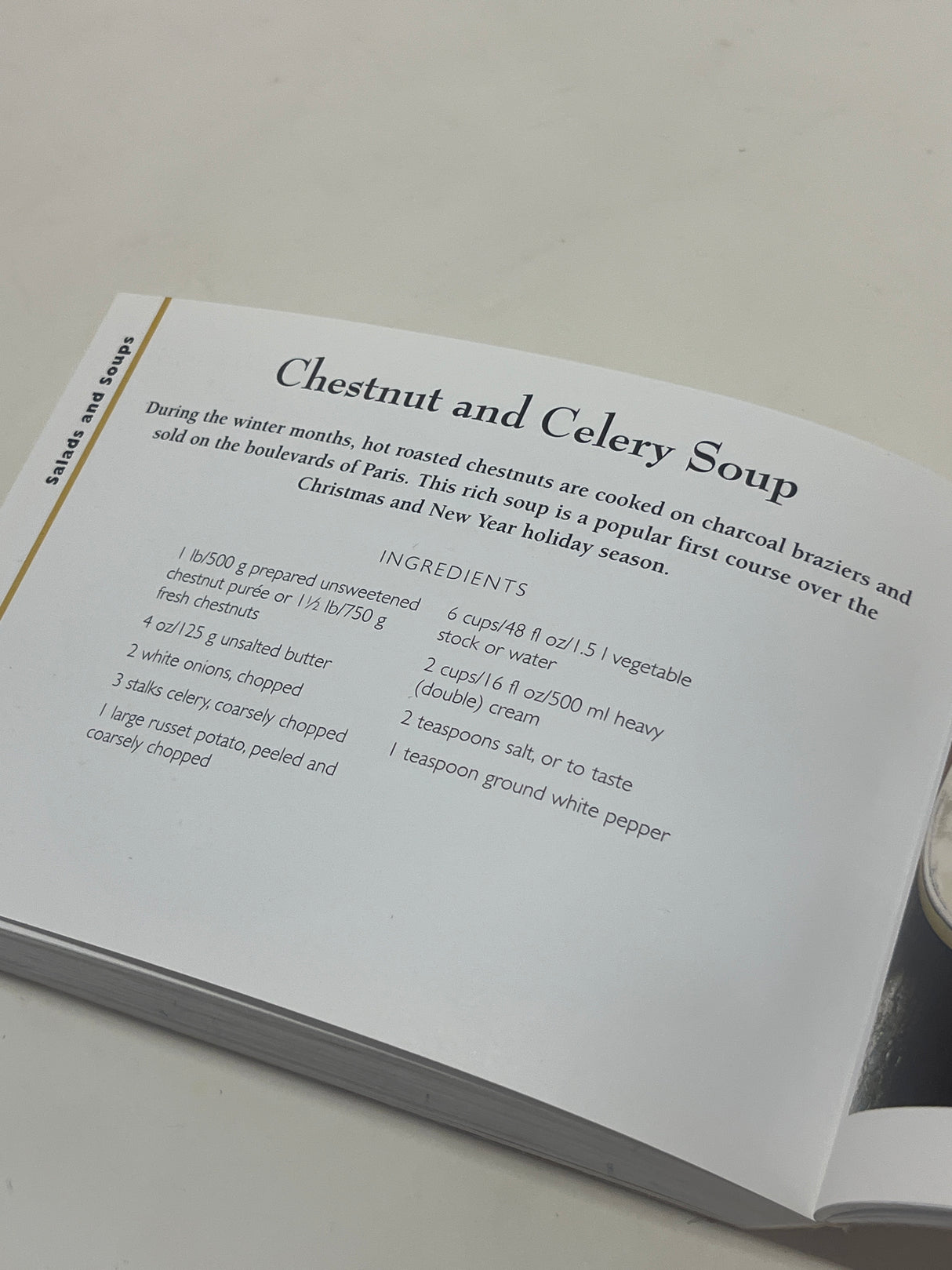 Open cookbook showing a recipe for “Chestnut and Celery Soup” from The Little Guides: Vegetarian, highlighting easy vegetarian recipes and cooking techniques.