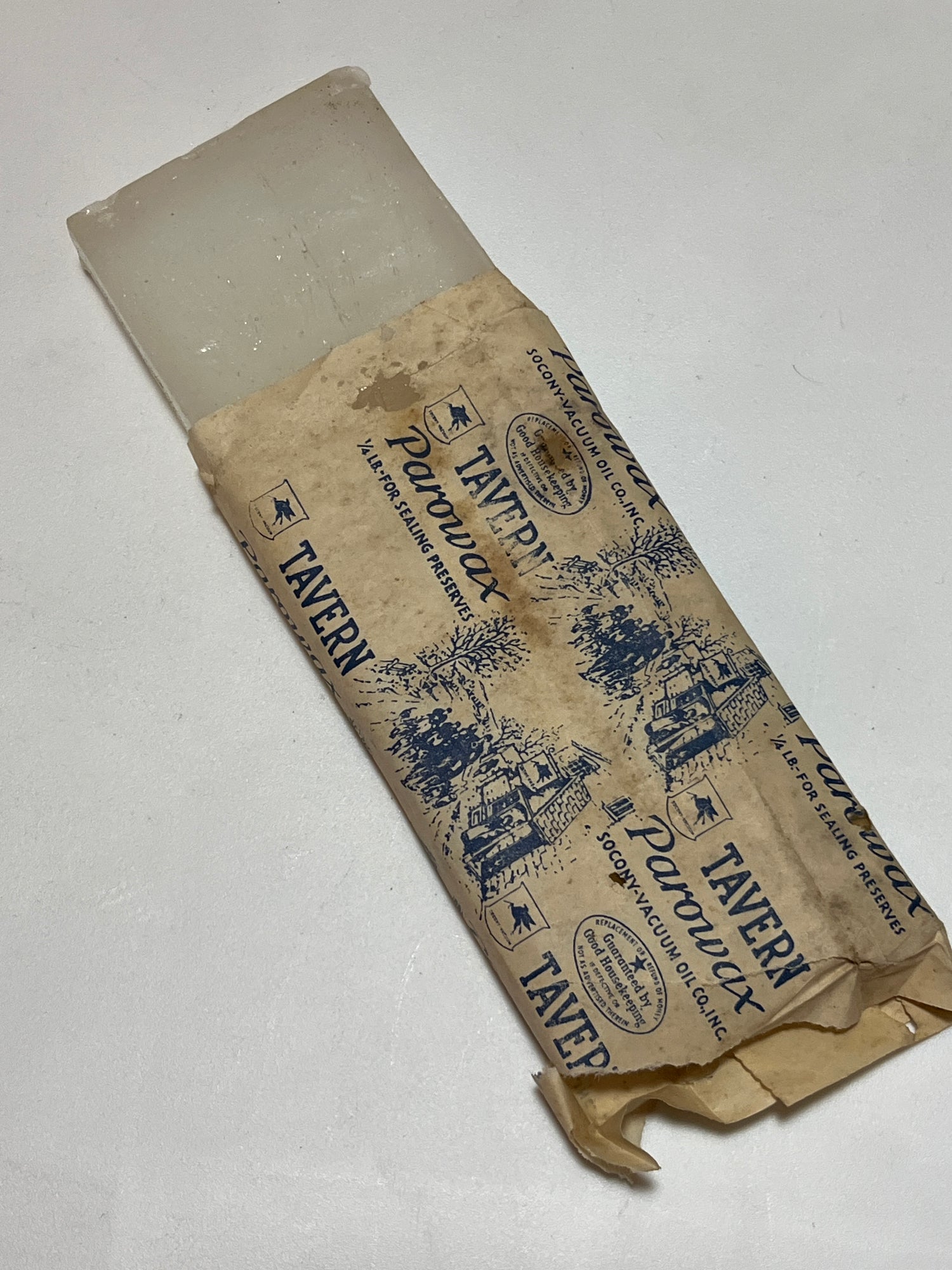 Tavern paraffin Parowax block from the 1960s, used for sealing canning jars, with slightly frayed and torn wrapping, still functional.