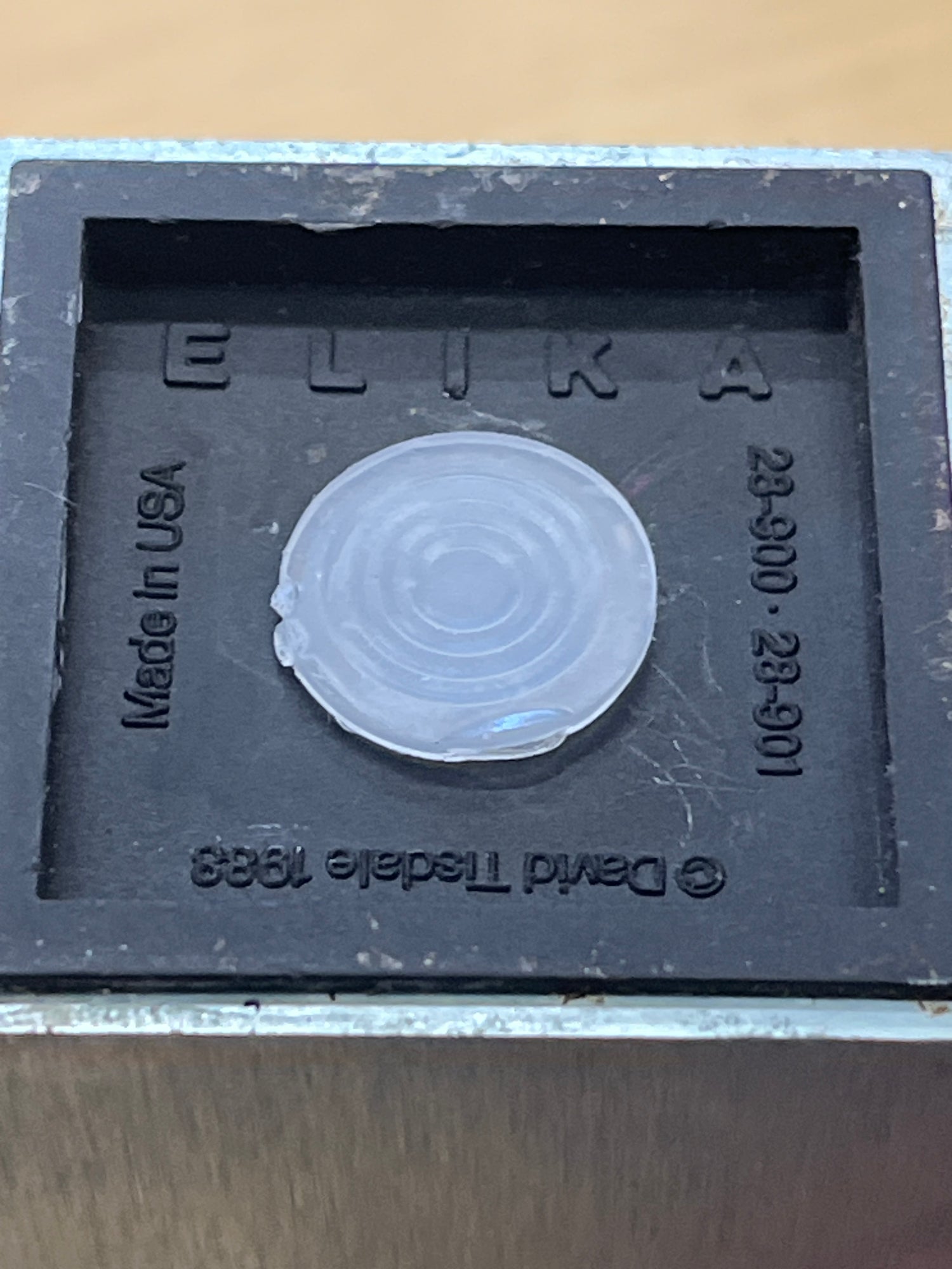 Elika anodized aluminum salt and pepper shakers by David Tisdale, 1988, featuring a geometric design with a distinctive circular pattern, embodying 1980s Memphis style.