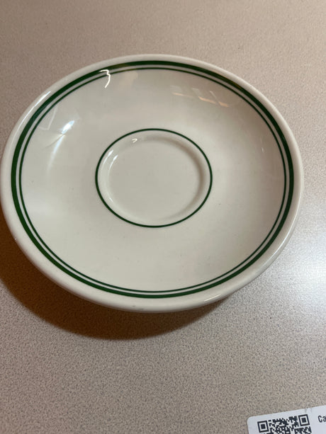Homer Laughlin China set includes plates, bowls, saucers, mugs, and a creamer, showcasing elegant design and craftsmanship for a refined dining experience.