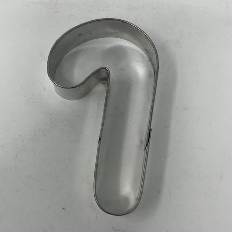 Mid-century metal cookie cutters featuring adaptive handles for easy grip, including vintage designs from the 1930s like Pillsbury's Comicooky Cutter, moons, stars, and holiday shapes.