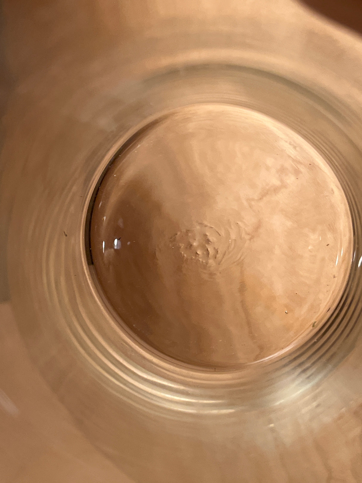 Top-down view of Libbey tall apothecary jar, showing concentric glass rings on a wooden surface, highlighting its clear, cylindrical design.