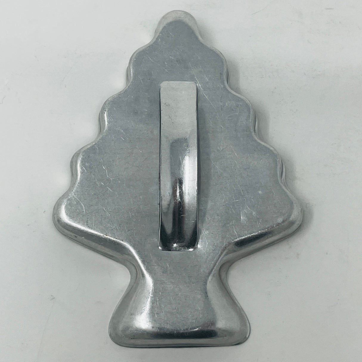 Mid century metal cookie cutters with adaptive handles, featuring holiday and celestial shapes, including rare 1930s designs like Pillsbury's Comicooky Cutter.