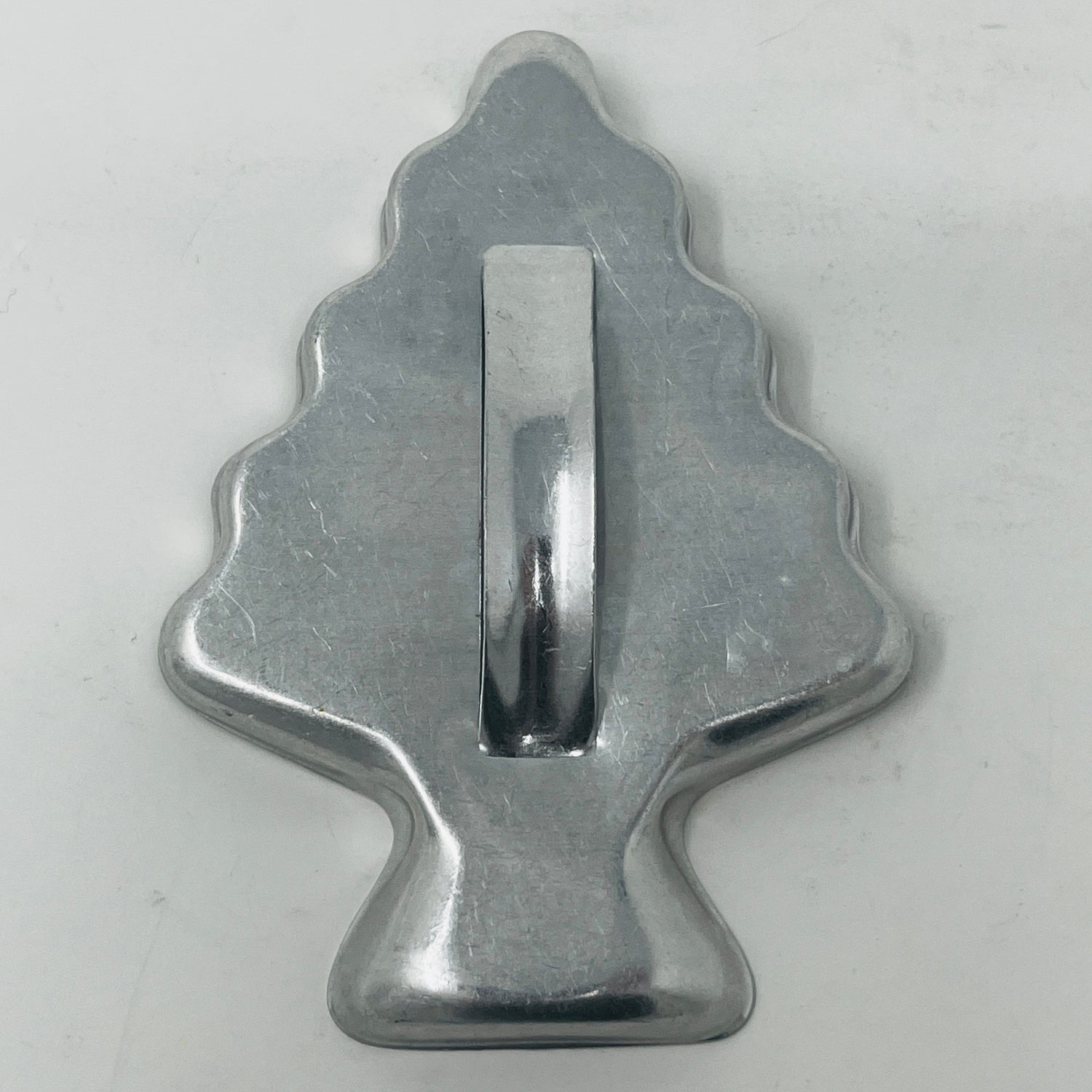 Mid century metal cookie cutters with adaptive handles, featuring holiday and celestial shapes, including rare 1930s designs like Pillsbury's Comicooky Cutter.