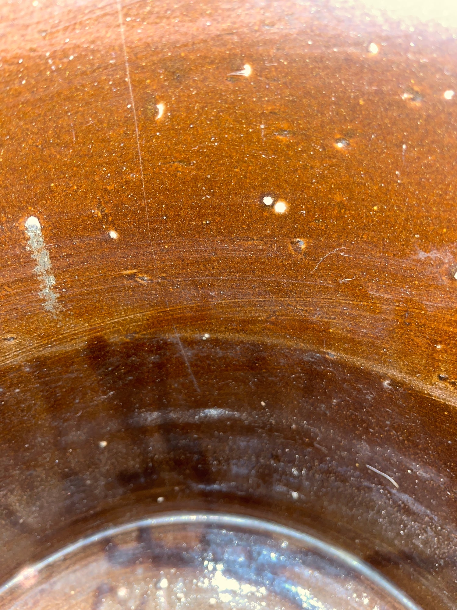 Antique 5 gallon stoneware ceramic pickling crock with a blue 5 stamp, featuring minor interior glaze pock-marks; otherwise in excellent condition.