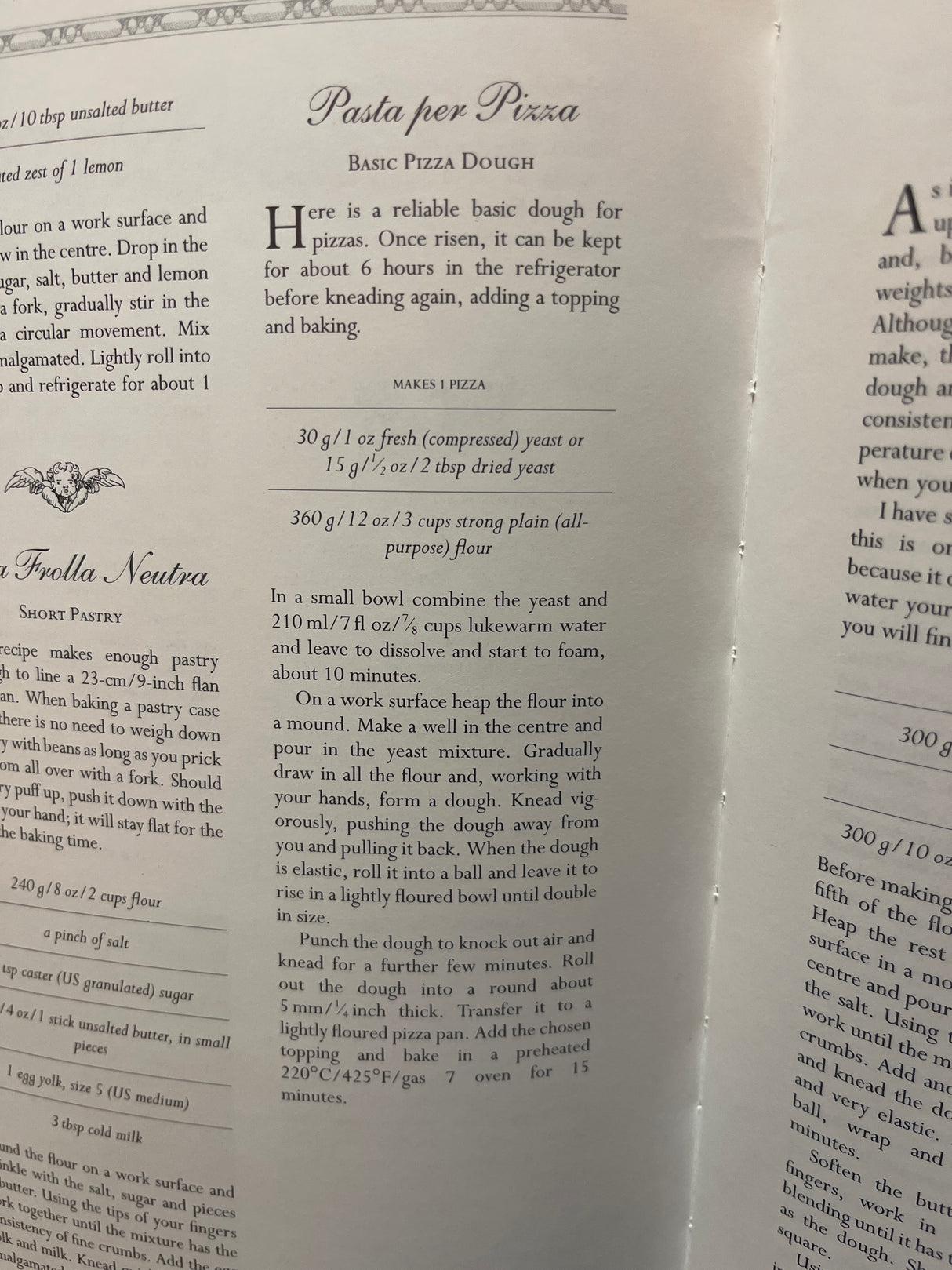 The Villa Table cookbook open to Basic Pizza Dough and Frolla Neutra recipes, showcasing metric and imperial measurements and detailed preparation steps.