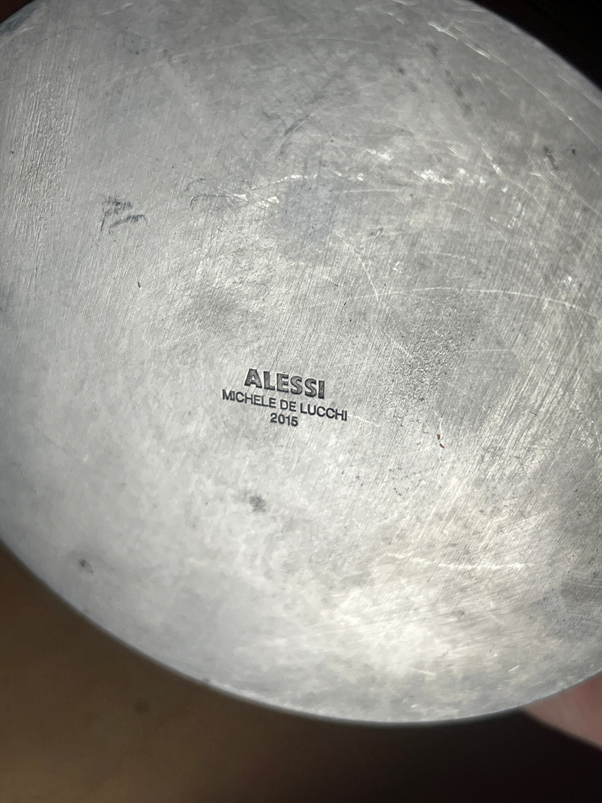 RARE Alessi Pulcina 6-cup moka pot underside showing ALESSI, Michele De Lucchi, and 2015 marks, highlighting its iconic design and craftsmanship.