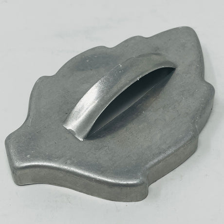 Mid-century metal cookie cutter with a large handle for easy grip, ideal for creating various shapes, including holiday and celestial designs.