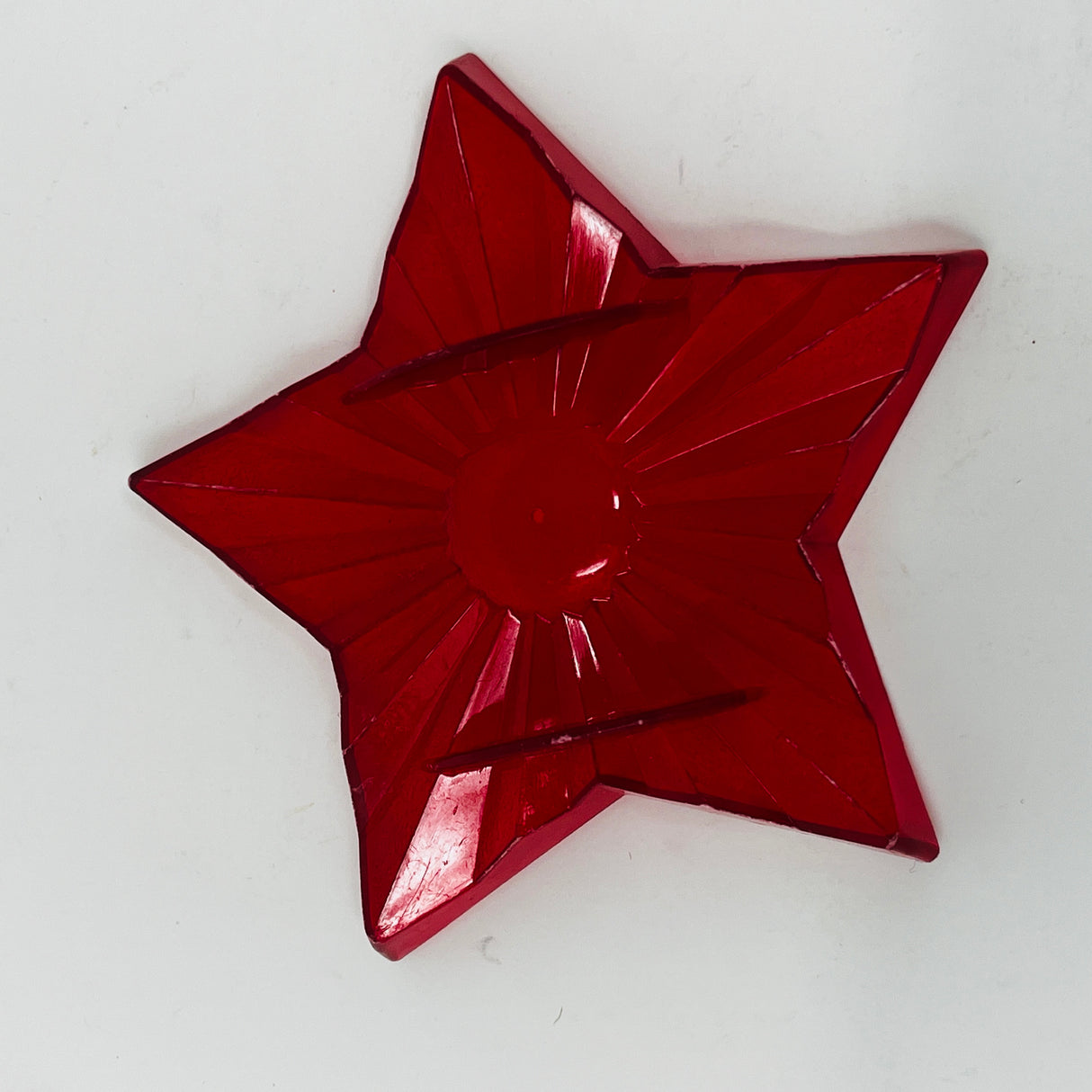 Red star and circle vintage cookie cutters on art paper.