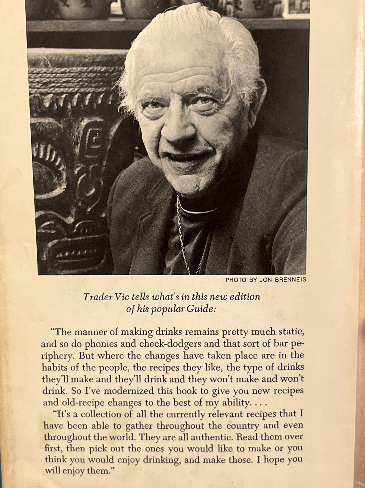 Trader Vic’s Bartender’s Guide (Revised 1972) features a portrait of Trader Vic, detailing updated recipes and insights on evolving drinking habits.