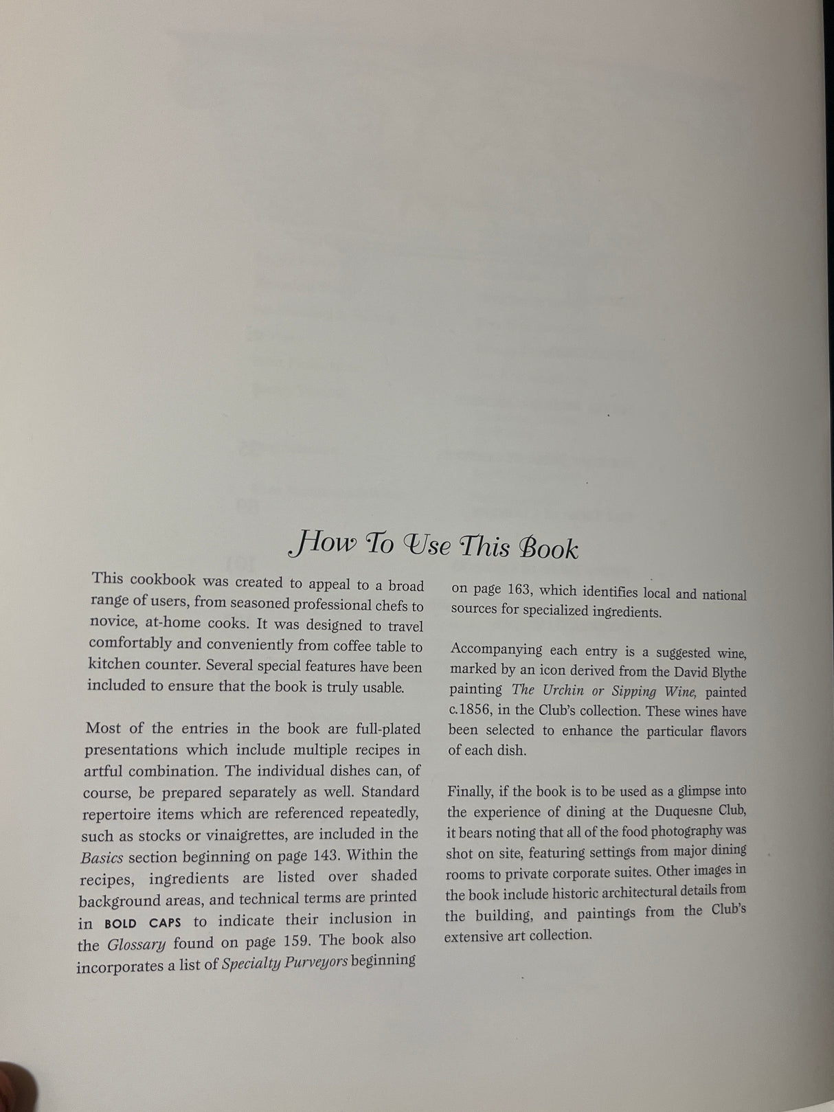 RARE Duquesne Club Cookbook open to How To Use This Book page, detailing recipe organization, glossary terms, and wine pairings, with historical photos and specialty purveyor list.