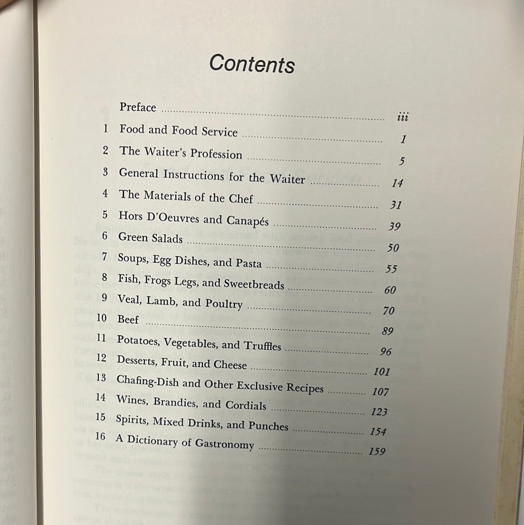 Gourmet Table Service - A Professional Guide book, featuring detailed text and illustrations on luxury dining service and food preparation techniques for waitstaff.