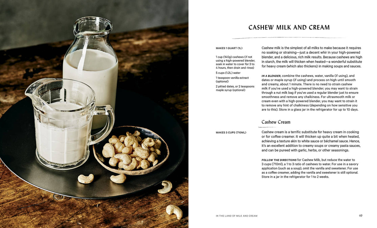 Two-page spread from The Vegan Creamery showing cashew milk and cream recipes, featuring a glass pitcher, mug, and cashews on a wooden table.