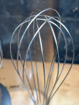 Cuisinart stick blender and whisk set HB-800PC, featuring a close-up of the durable stainless-steel balloon whisk, ideal for baking and emulsifying sauces.