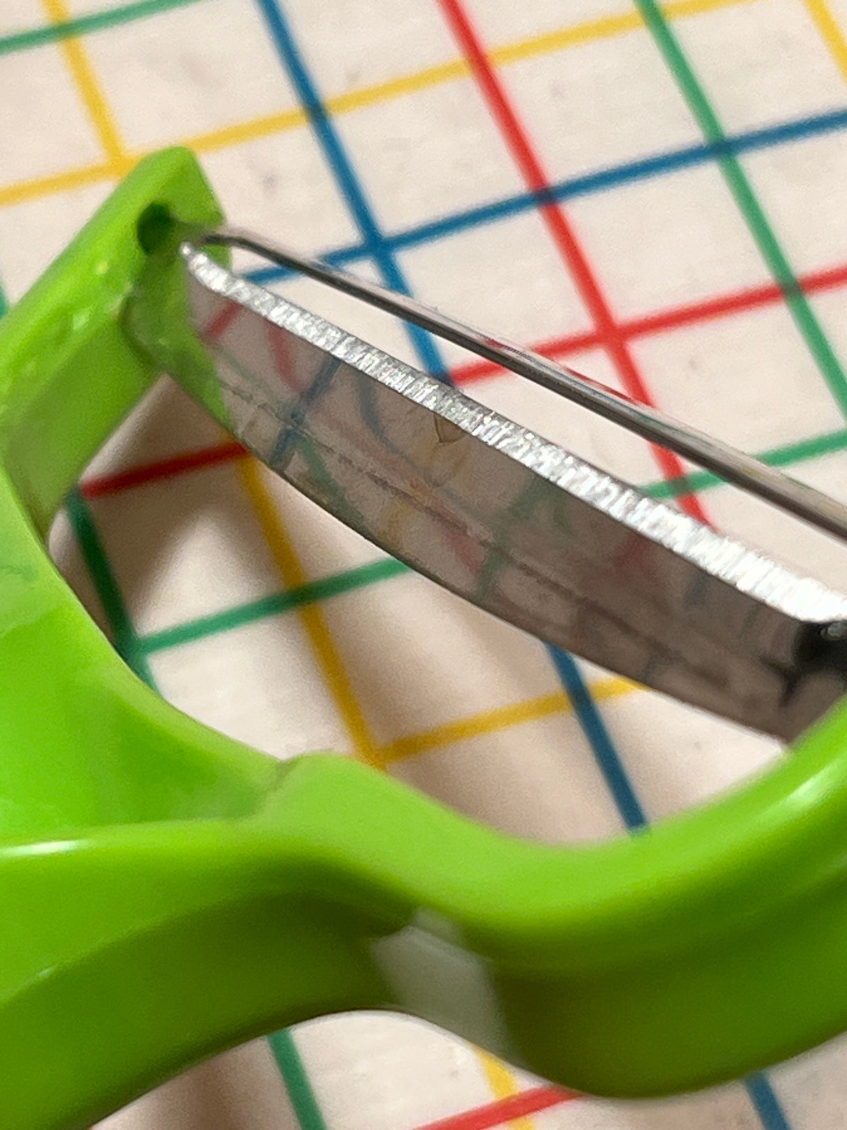 Food Y-Peeler for shredding cabbage - stainless steel blade and green plastic handle
