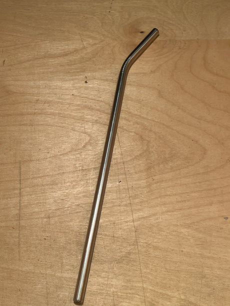 Stainless steel extra wide drinking straw with a gentle bend, displayed on a wooden surface, highlighting its durable and reusable design.
