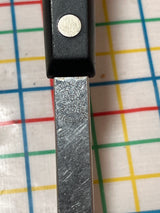 Slotted serving spoon - stainless steel with Bakelite handle by EKCO Forge, features a perforated bowl for draining, shown with their logo on the handle.