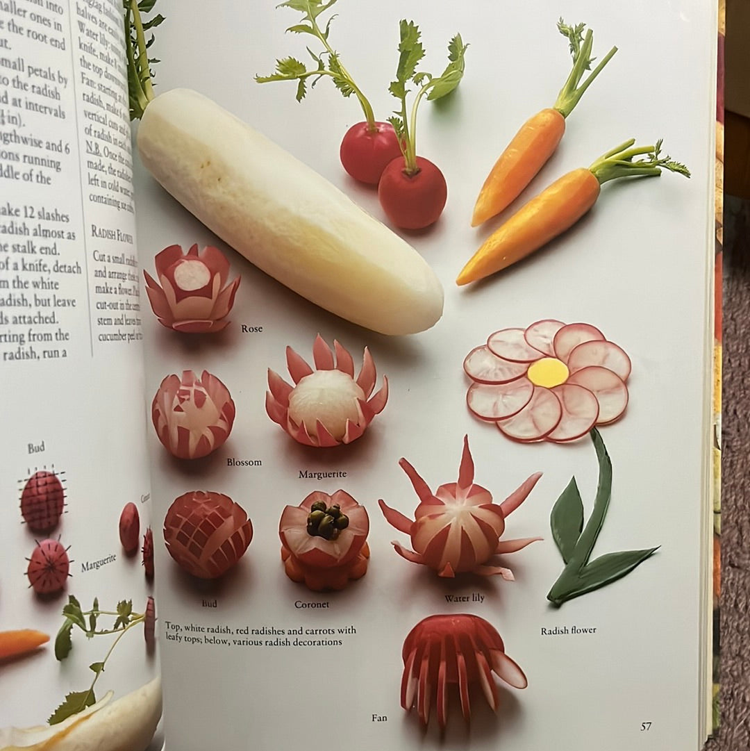 Garnishing and Decoration book featuring vibrant images of vegetables and flowers, showcasing artistic food presentation techniques by chef Rudolf Biller.