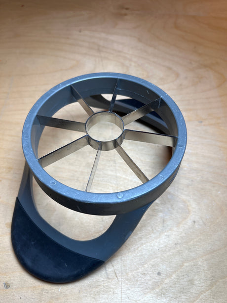 Pineapple corer - Hamilton Beach: Stainless steel tool with radial blades and silicone-plastic handles for coring and slicing fruit into eight wedges.