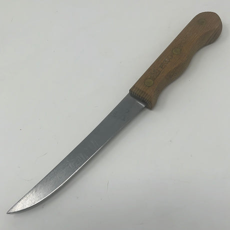 A utility knife with a wooden handle, ideal for slicing meat, fruit, and veggies. EKCO Forge Utility 6 Inch Knife, featuring a narrow, long blade.